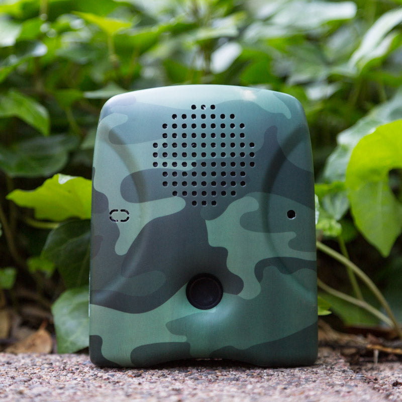Dog Silencer MAX with camouflage faceplate against foliage